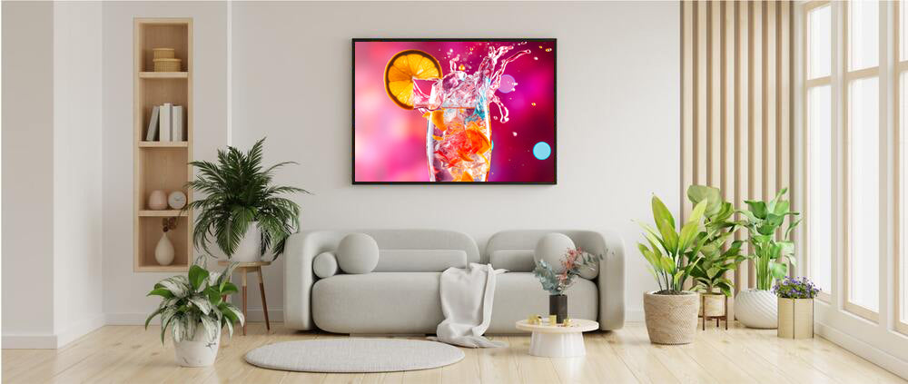 Bright Vibrant Pink Background Supporting a Clear Refreshing Drink With A Slice Of Lemon